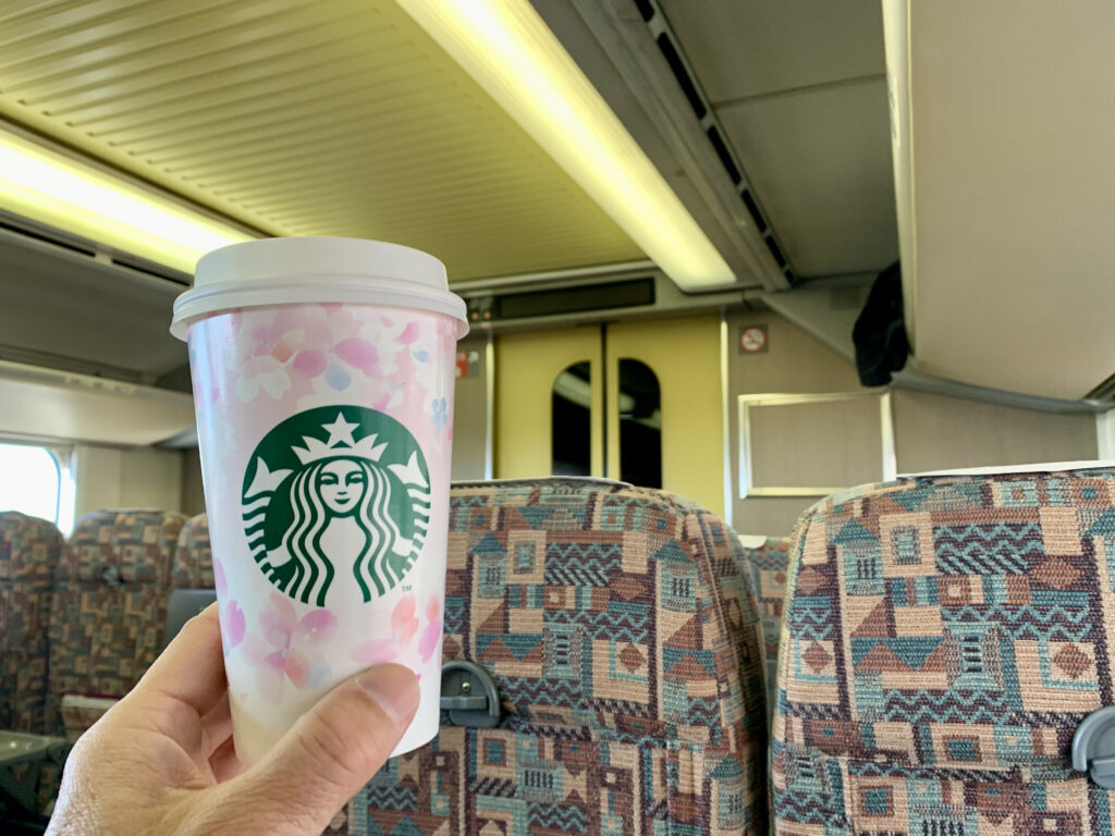 Drinking a Starbucks latte on the Max Tanigawa train bound for Echigo Yuzawa